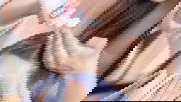 rid lice shampoo treatment 2 Parent using rid lice shampoo on child in Spring Grove Illinois