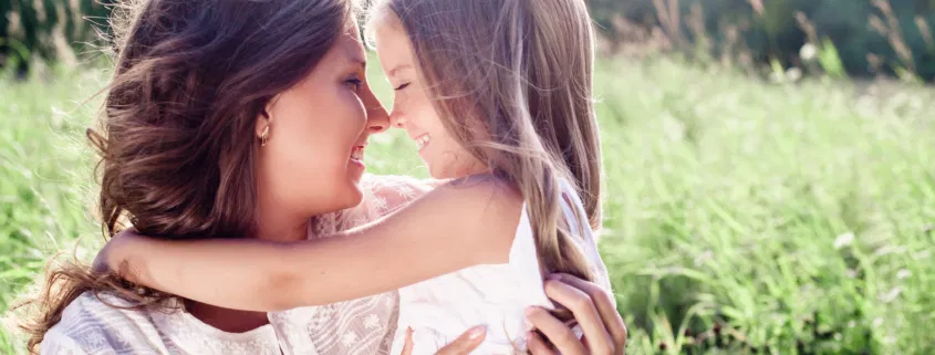 Mother and daughter are smiling together in Northern IL happy they do not have lice